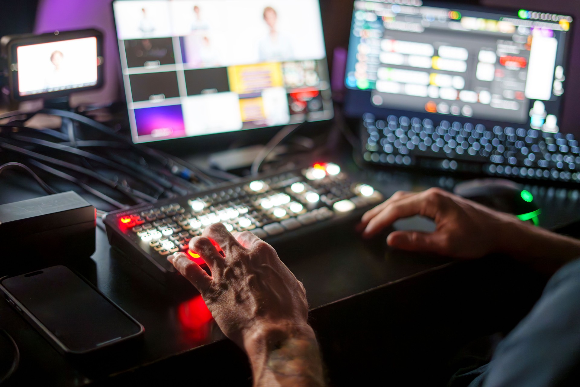 TV Director Operating Control Panel in Studio During Live Streaming Production